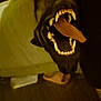 Kookie joined the competition — help win amazing prizes! dog, mouth, teeth, tongue, indoor, blurry, grainy, dark, close_up, animal, pet, floor, furniture, paw, foot, canine, yawn, open_mouth, black_dog, tongue_out