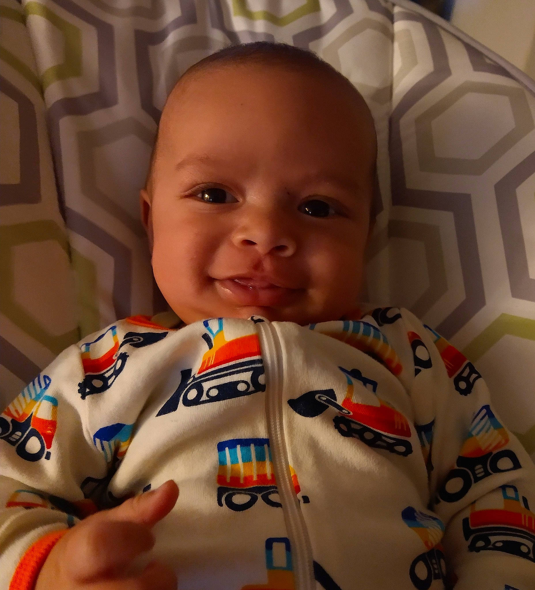 Jakobe is registered to the contest to win money with this photo: baby, cheek, chin, collar, eye, eyebrow, face, finger, forehead, hairstyle, happy, head, human_body, joy, mouth, neck, nose, person, skin, sleeve