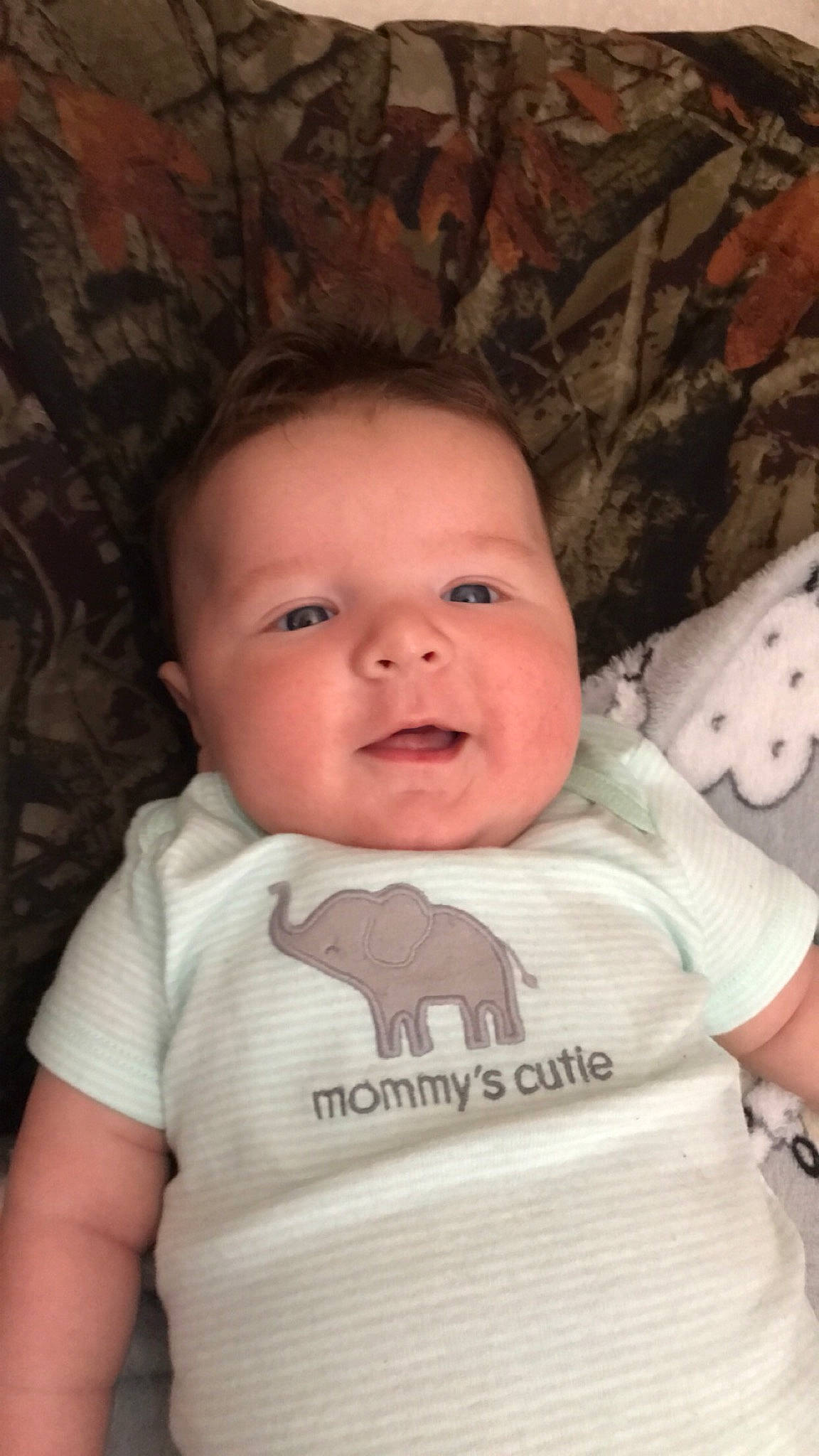 Dustin is registered to the contest to win money with this photo: baby, baby_toddler_clothing, cheek, chin, eye, eyebrow, eyelash, flash_photography, hairstyle, happy, iris, lip, mouth, nose, person, skin, sleeve, smile, t_shirt, toddler