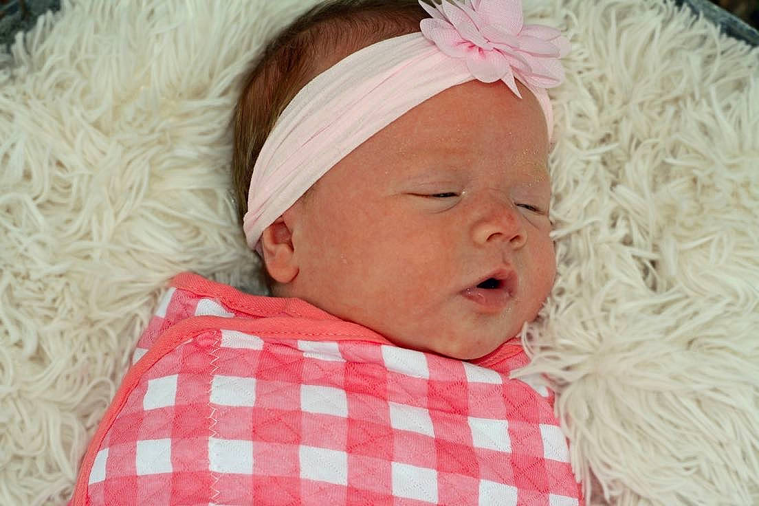 Chloe is registered to the contest to win money with this photo: baby, baby_toddler_clothing, cheek, child, chin, comfort, event, eye, face, happy, hat, head, linens, mammal, person, pink, room, skin, textile, toddler