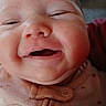Ebony is registered to the contest to win money with this photo: baby, smiling, face, close_up, infant, cheeks, clothing, button, cute, happy, child, skin, mouth, eyes, person, young, portrait, indoors, soft, warm
