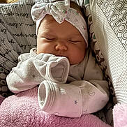 Ebony joined the competition — help win amazing prizes! baby, sleeping, headband, blanket, bassinet, infant, cozy, patterned, cute, soft, clothing, pink, white, peaceful, child, newborn, resting, indoors, portrait, toddler