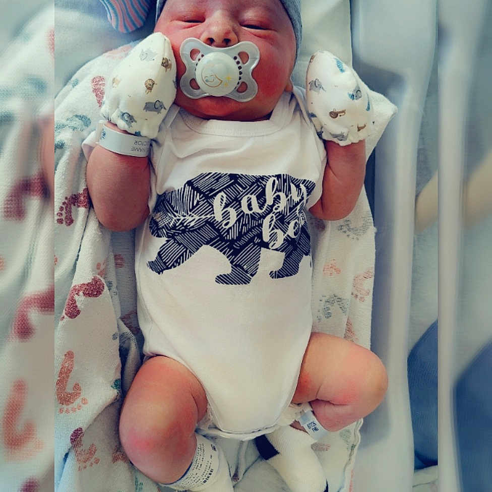 Ares is registered to the contest to win money with this photo: arm, baby, baby_products, baby_safety, baby_sleeping, baby_toddler_clothing, cheek, child, comfort, happy, linens, pattern, pink, room, service, skin, thigh, thumb, toddler, white