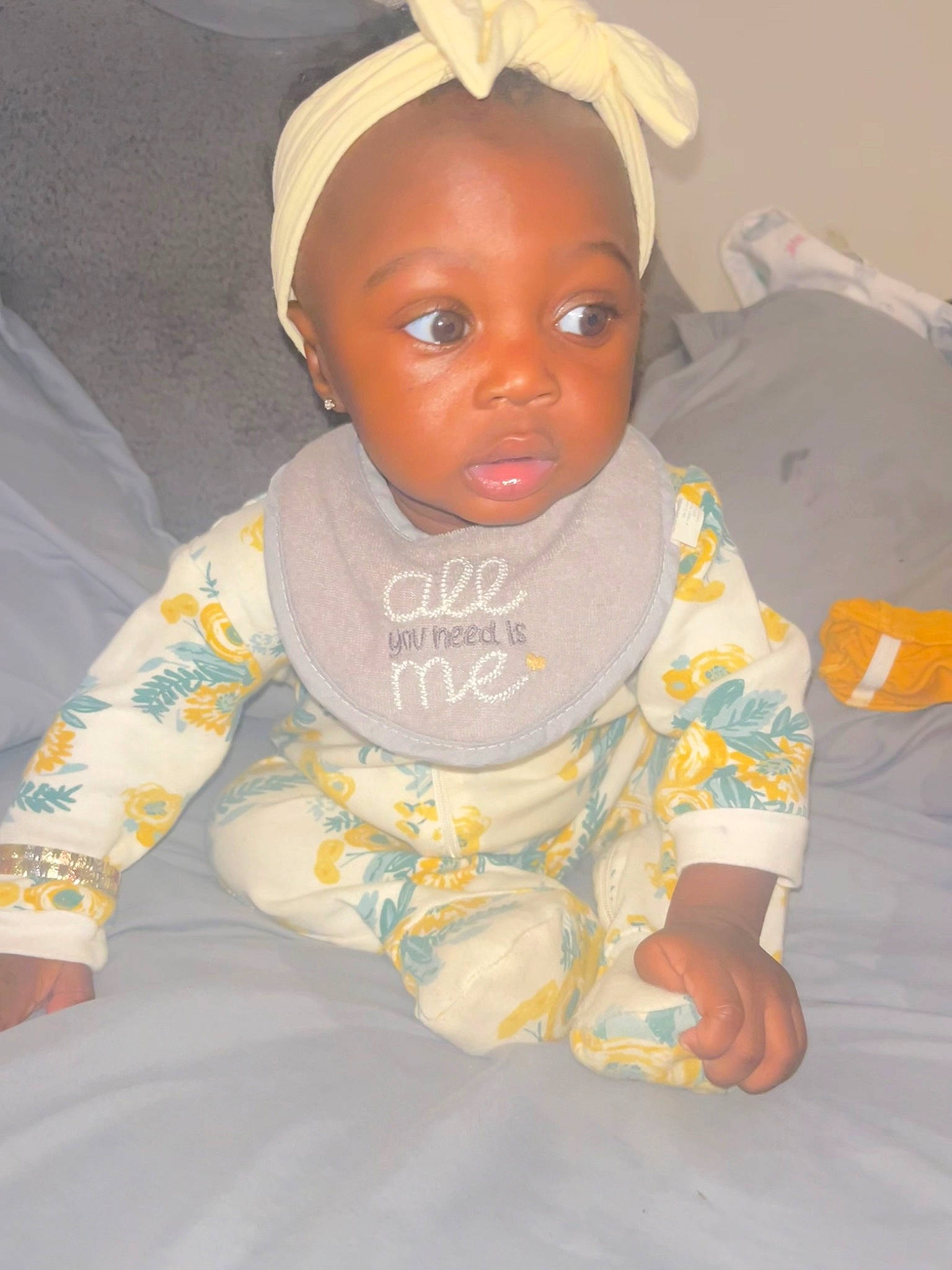 Jordyn is registered to the contest to win money with this photo: baby, baby_products, baby_safety, baby_toddler_clothing, cheek, child, comfort, happy, head, headgear, human_body, iris, linens, nose, person, room, sitting, sleeve, smile, t_shirt