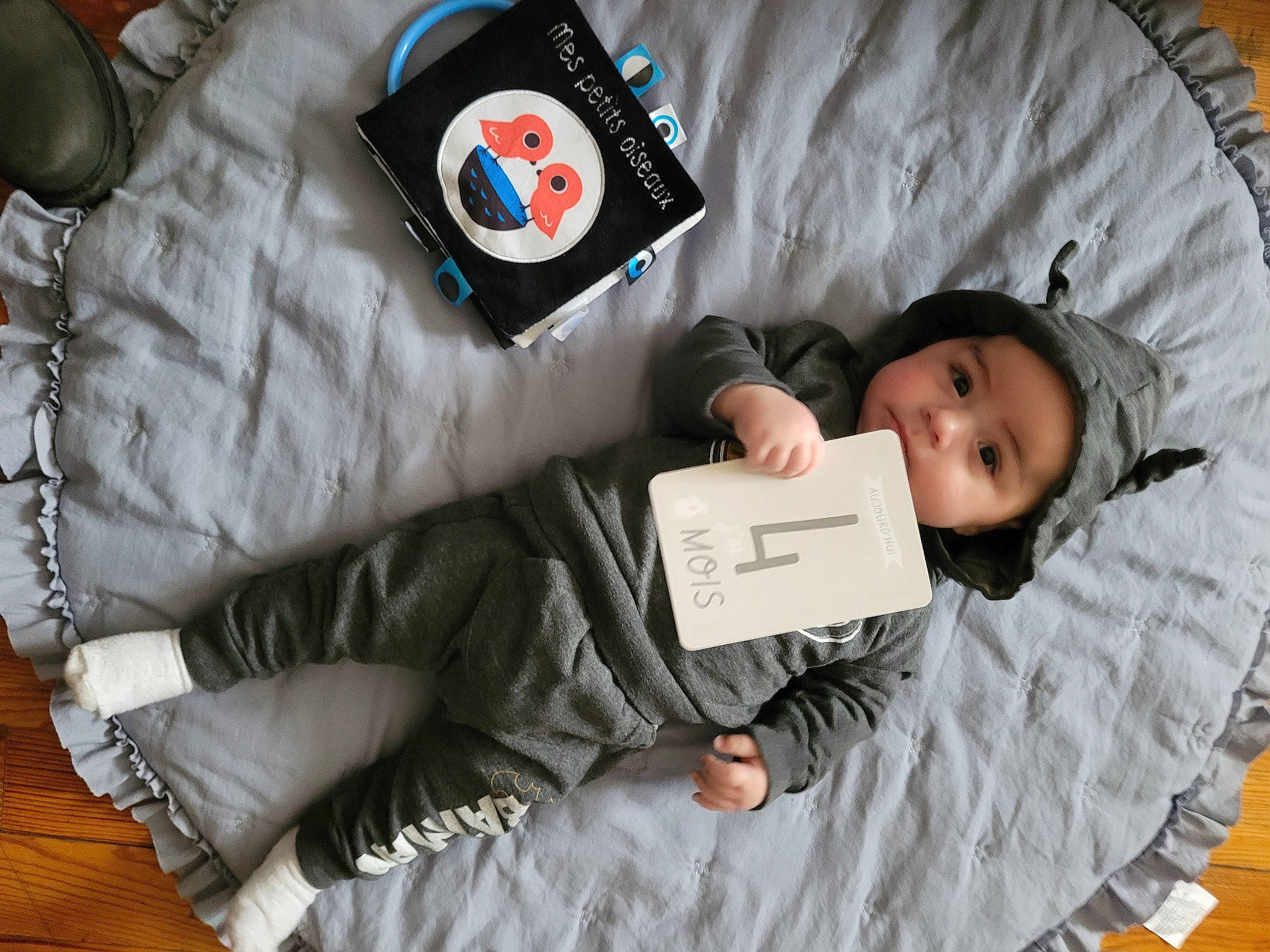 Joseph participe au concours pour gagner de l'argent avec cette photo : baby, baby_products, baby_toddler_clothing, child, comfort, headgear, headwear, jacket, linens, outerwear, person, personal_protective_equipment, room, sleeve, smile, stuffed_toy, t_shirt, textile, toddler, toy