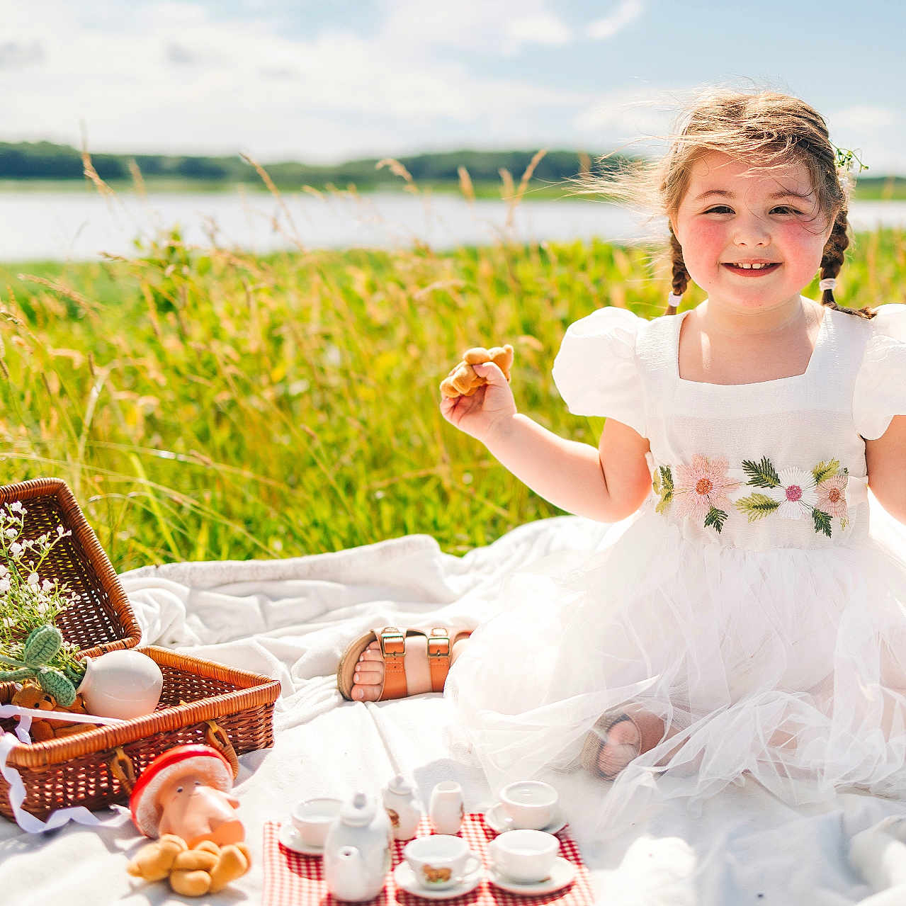 Emberlee is registered to the contest to win money with this photo: beverage, child, clothing, coffee, coffeecup, cup, dress, face, female, footwear, fun, girl, happy, head, leisureactivities, person, picnic, picnicbasket, plate, sandal