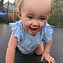baby, toddler, child, smiling, crawling, trampoline, backyard, outdoors, blue_outfit, polka_dots, hands, face, hair, cheeks, happy, eyes, skin, infant, fence, net_enclosure