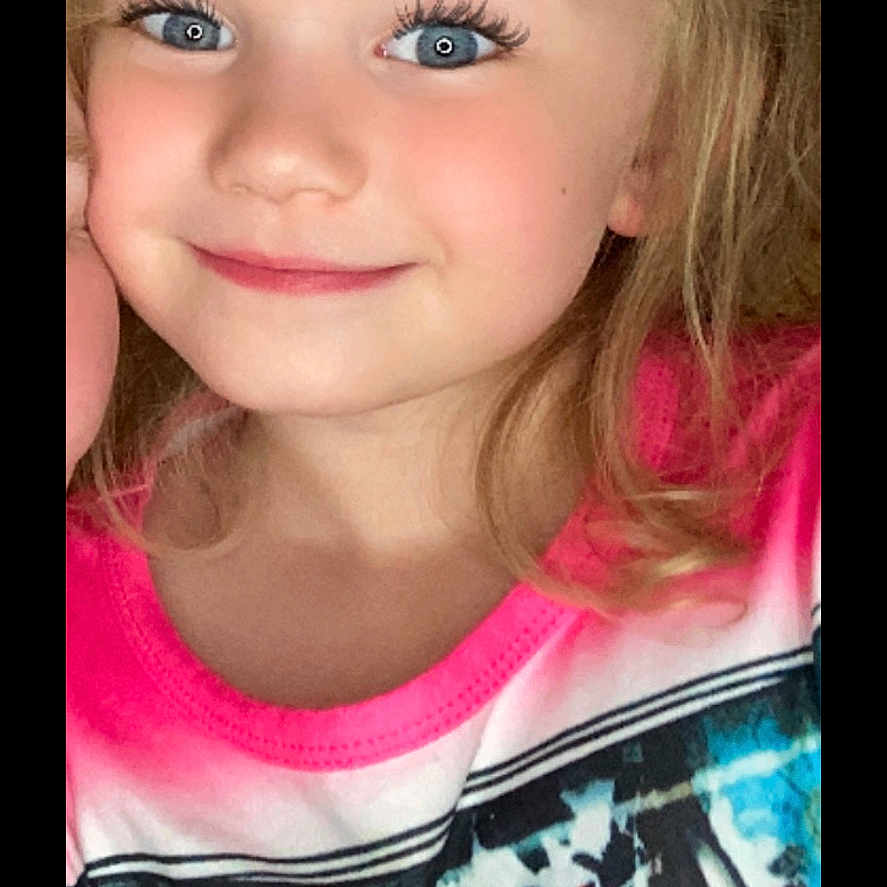 Khloe is registered to the contest to win money with this photo: accessories, blonde, bodypart, child, clothing, dress, face, female, girl, hair, happy, head, mouth, person, photography, portrait, selfie, smile, t_shirt, teeth