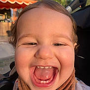 Lïon participe au concours pour gagner de l'argent avec cette photo : toddler, child, smile, happy, face, teeth, tongue, scarf, brown, outdoor, daylight, closeup, cute, person, baby, head, skin, expression, joy, warm