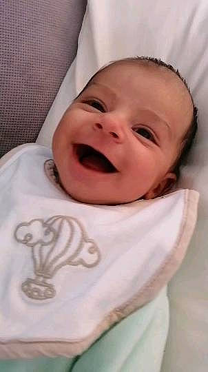 Souleyman participe au concours pour gagner de l'argent avec cette photo : baby, baby_laughing, baby_products, baby_toddler_clothing, cheek, child, comfort, face, happy, laugh, linens, lip, person, pink, room, skin, sleeve, smile, t_shirt, textile