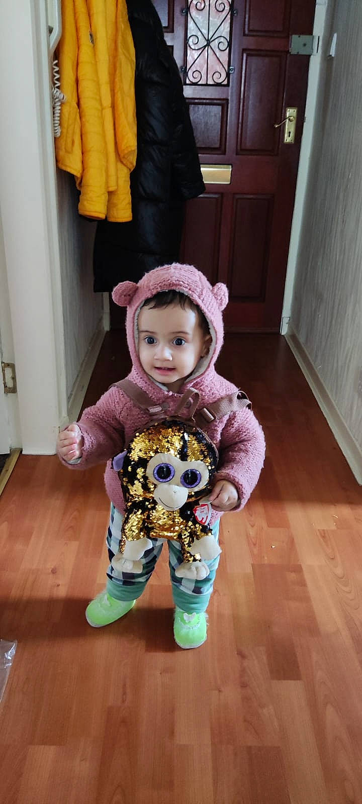 Kiana joined the competition — help win amazing prizes! baby, baby_toddler_clothing, child, door, eye, floor, flooring, fun, happy, hardwood, headwear, orange, outerwear, person, purple, shoe, skin, sleeve, smile, standing