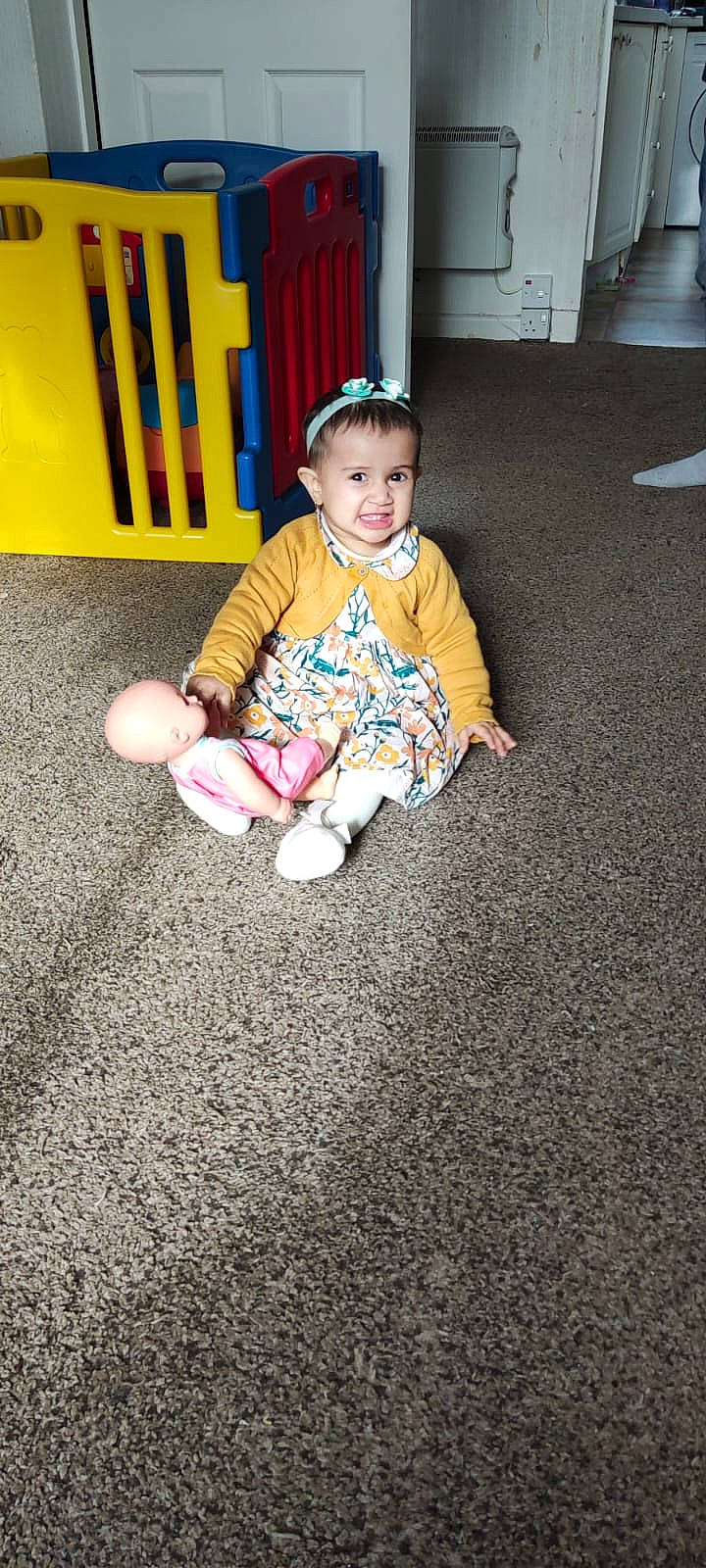 Kiana joined the competition — help win amazing prizes! baby, baby_toddler_clothing, ball, child, eye, floor, flooring, fun, grass, hairstyle, happy, human_leg, magenta, person, room, sitting, sleeve, smile, sock, toddler
