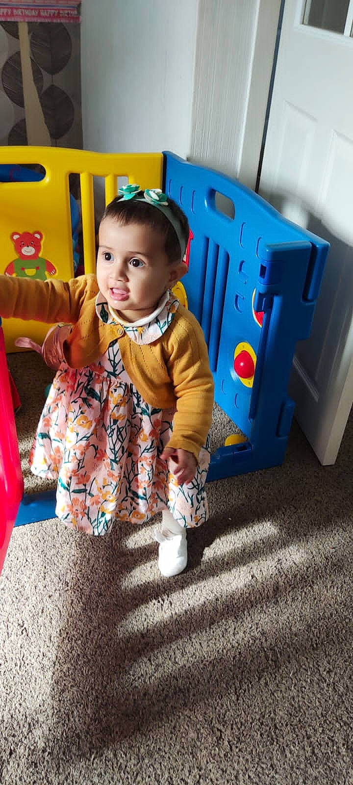 Kiana is registered to the contest to win money with this photo: baby, baby_playing_with_toys, baby_products, baby_toddler_clothing, baby_toys, child, electric_blue, event, eye, flooring, fun, happy, leisure, machine, person, play, sitting, smile, standing, toddler