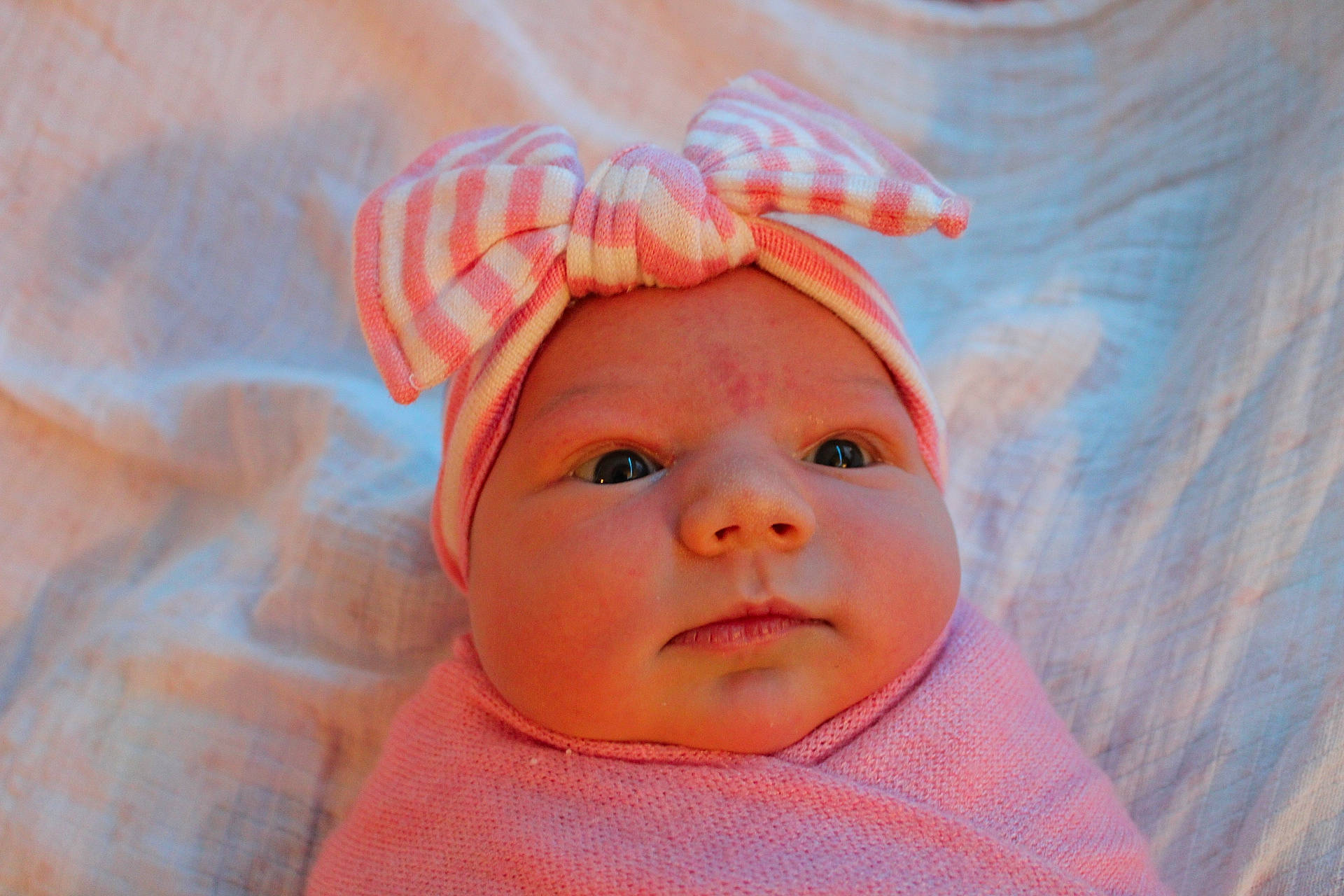 Kelsie is registered to the contest to win money with this photo: baby, baby_toddler_clothing, cheek, child, comfort, fashion_accessory, happy, headgear, headwear, linens, lip, magenta, nose, orange, paint, person, pink, skin, sleeve, smile