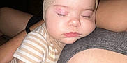 Alani is registered to the contest to win money with this photo: baby, sleeping, headband, bow, cuddling, arm, striped_clothing, person, child, infant, closeup, skin, face, hand, nap, toddler, indoor, rest, comfort, cozy