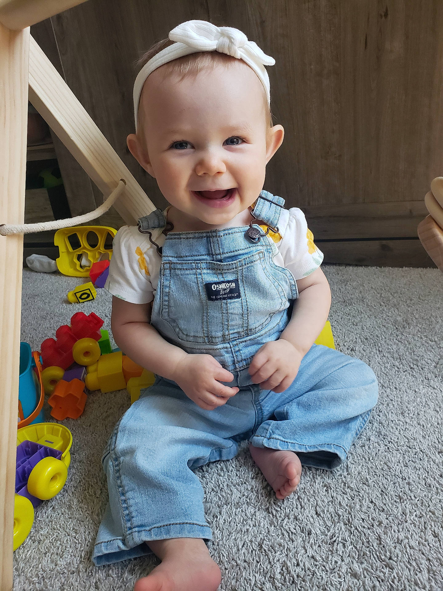 Emilia joined the competition — help win amazing prizes! baby, bathroom, bodypart, clothing, face, finger, hand, happy, head, indoors, jeans, pants, person, photography, portrait, room, sitting, smile, toilet, wood