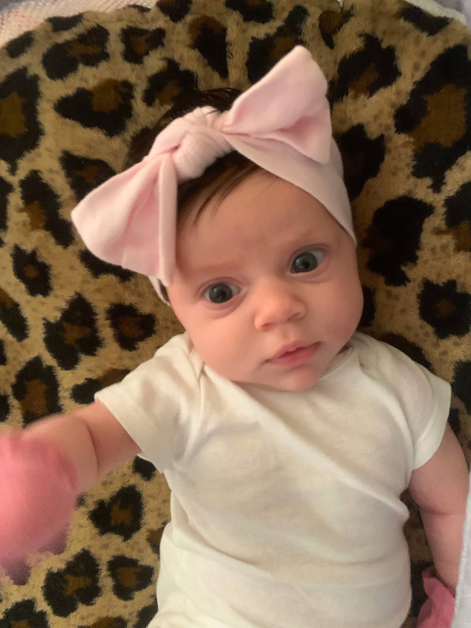 Fallon is registered to the contest to win money with this photo: baby, baby_products, baby_toddler_clothing, cap, cheek, child, comfort, face, fashion_accessory, hat, headgear, headwear, linens, mammal, pattern, person, pink, skin, sleeve, t_shirt