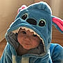 Freya joined the competition — help win amazing prizes! baby, child, costume, blue, hood, indoor, cute, face, person, plush, animal_costume, pink, eyes, soft_light, floor, expression, portrait, clothing, young, infant