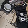 animal, bathroom, boxer, bulldog, canine, clothing, dog, footwear, glove, hound, husky, indoors, pet, pitbull, puppy, room, shoe, t_shirt, tile, toilet