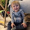 Zander joined the competition — help win amazing prizes! toddler, child, smiling, sitting, cat, indoor, floor, wooden_floor, plush_toy, snowman, christmas_tree, holiday, clothing, hoodie, socks, face, furniture, table, happy, pet