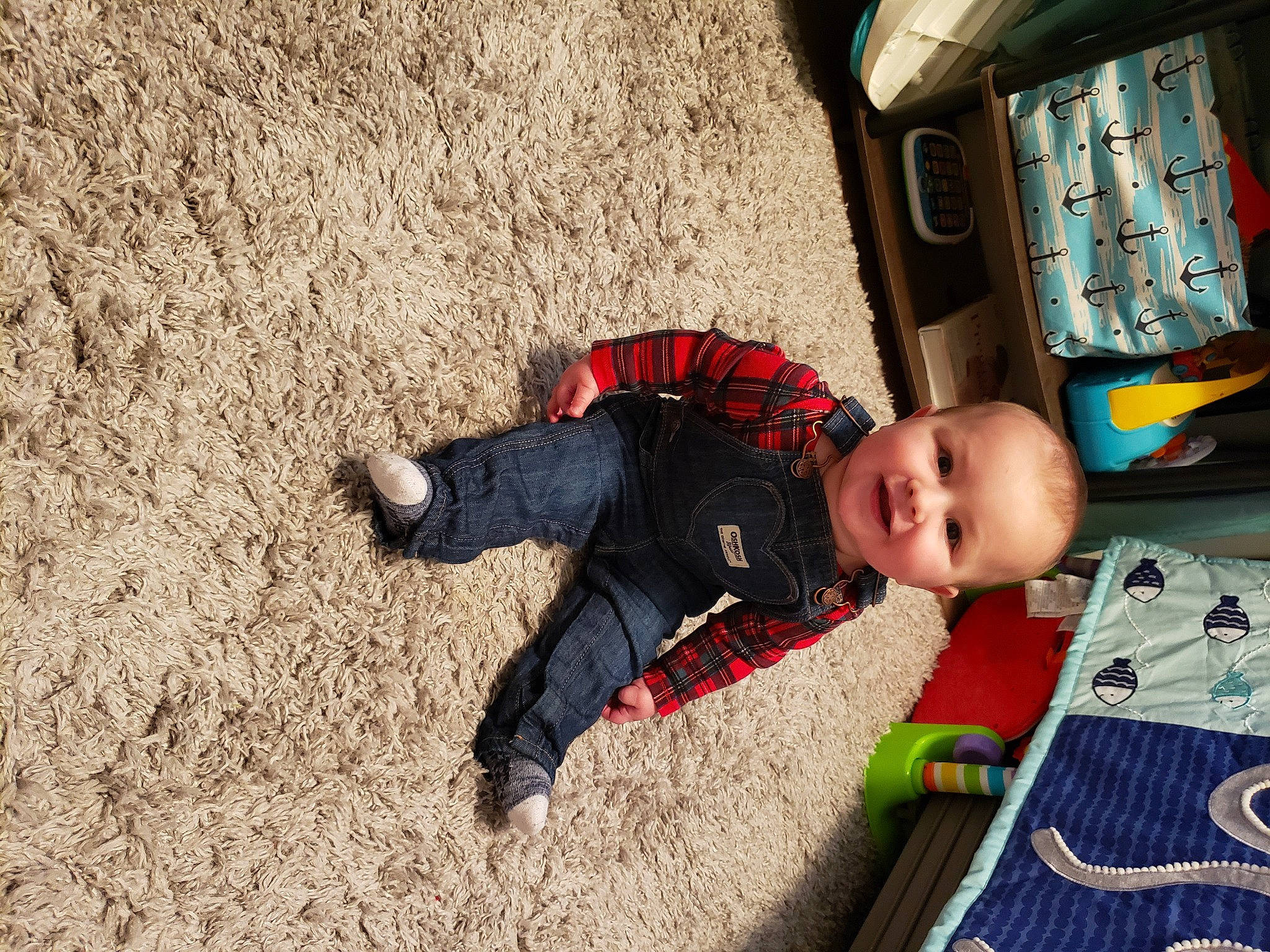 Jeffrey is registered to the contest to win money with this photo: analog_television, baby, baby_toddler_clothing, child, joy, linens, nose, overall, person, play, sand, shadow, television, toddler, walking_shoe