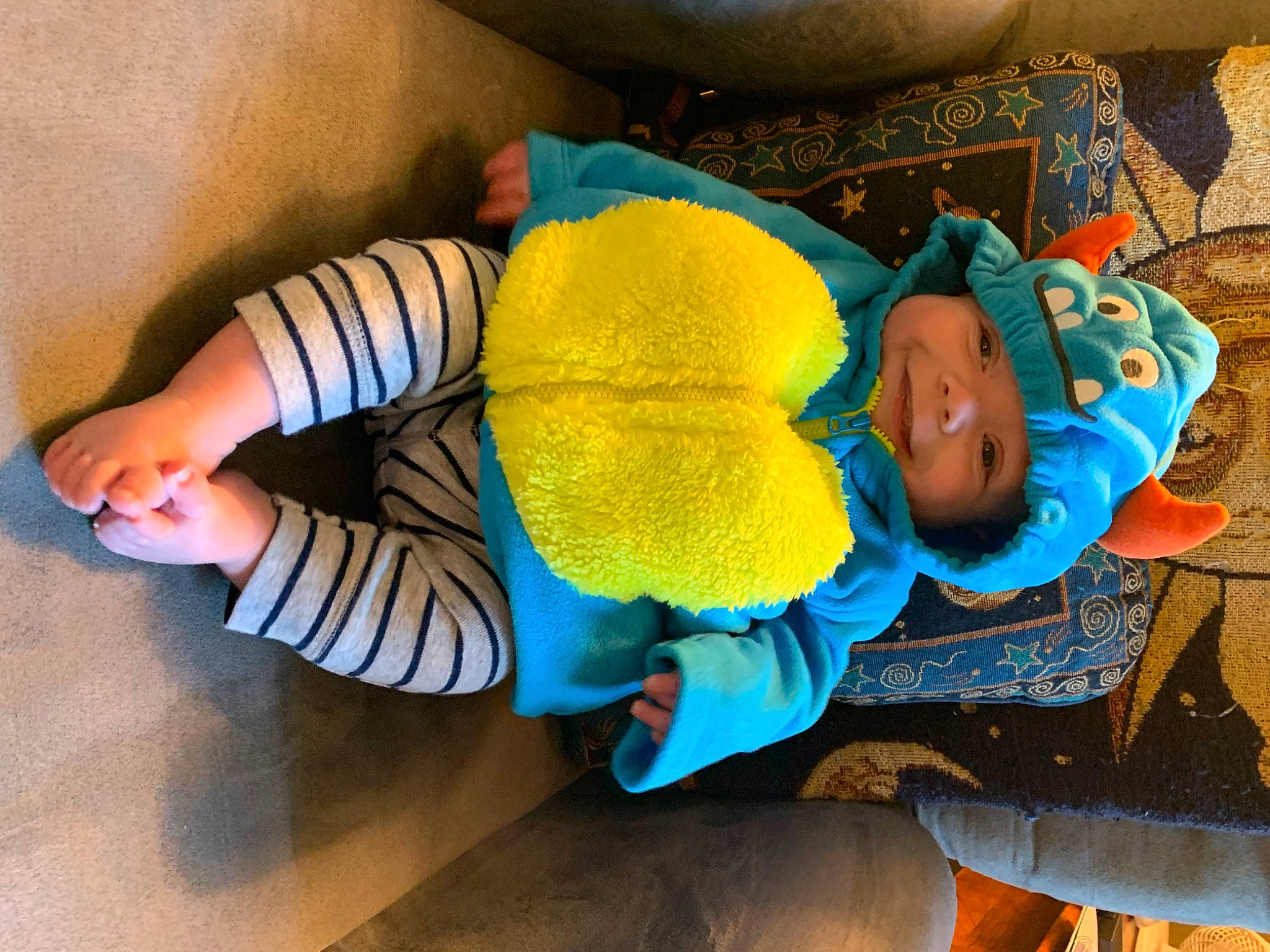 Bentlee joined the competition — help win amazing prizes! baby, baby_products, baby_safety, baby_sleeping, baby_toddler_clothing, baby_toys, bedtime, child, comfort, electric_blue, headgear, headwear, infant_bed, linens, orange, person, plush, room, sitting, stuffed_toy