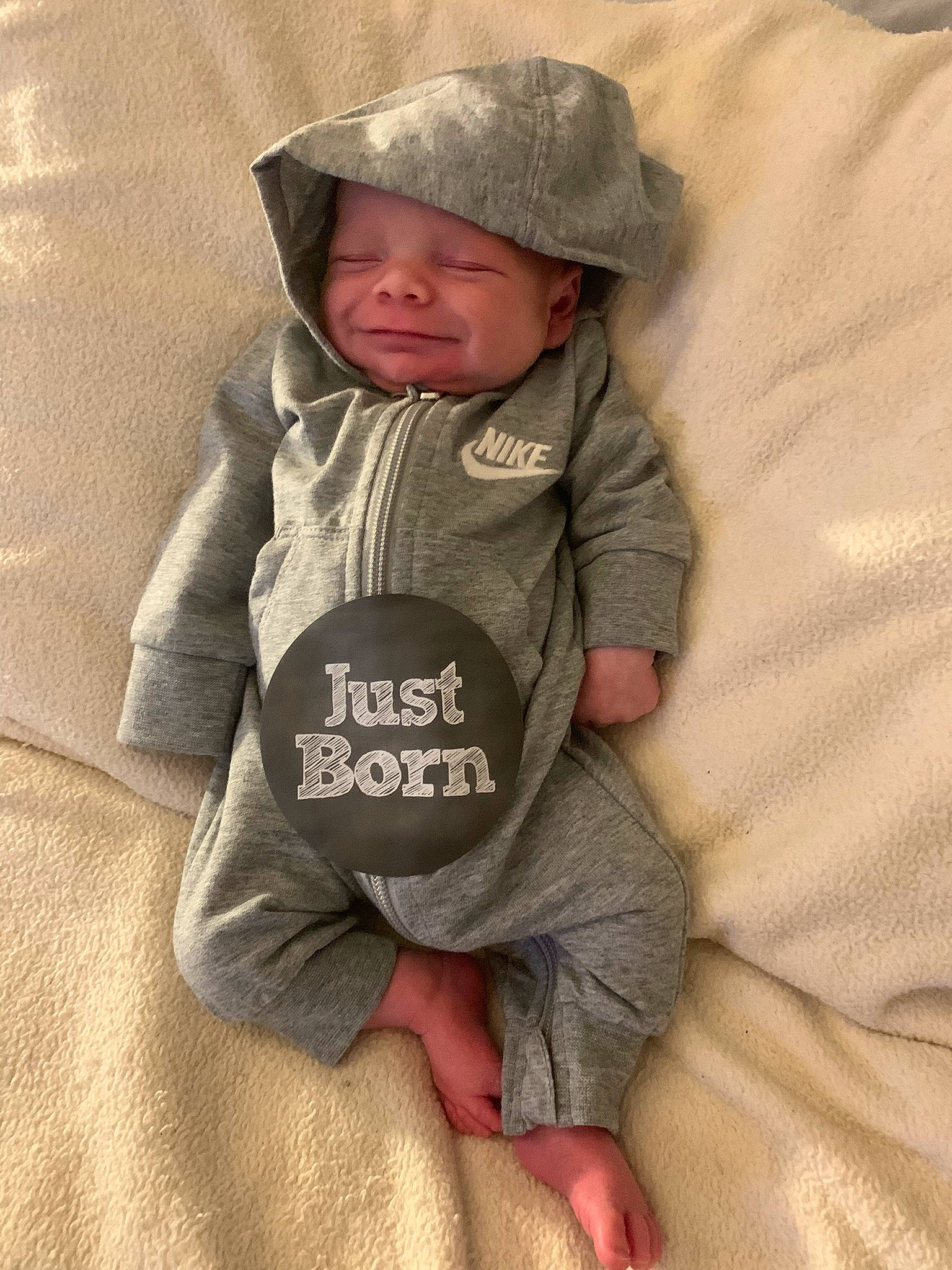 Bentlee is registered to the contest to win money with this photo: baby, baby_toddler_clothing, cap, child, comfort, fur, grey, headwear, hood, hoodie, landscape, linens, outerwear, person, sand, sitting, skin, sleeve, t_shirt, toddler