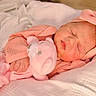 Amara joined the competition — help win amazing prizes! newborn, baby, sleeping, pink, headband, plush_toy, blanket, soft, cute, infant, cozy, portrait, child, peaceful, resting, indoors, clothing, closeup, baby_girl, toddler