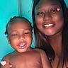 adult, bare_chested, child, close_up, dark_skin, face, family, filter, happy, home, indoor, long_hair, people, photography, pink_hearts, portrait, selfie, smiling, toddler, woman