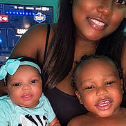 Tyanna joined the competition — help win amazing prizes! baby, bow, brother, child, clothing, family, happy, headband, home, indoor, infant, portrait, selfie, sibling, sitting, smiling, television, toddler, woman, zebra_pattern
