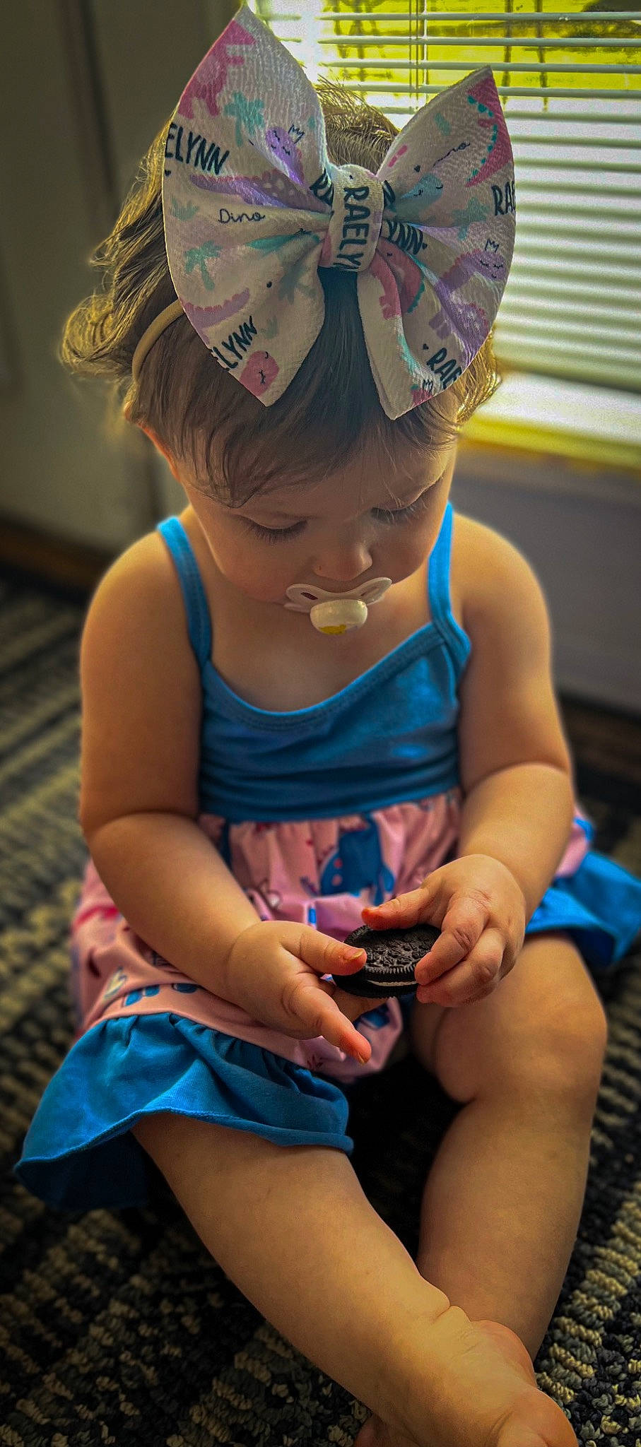 Raelynn is registered to the contest to win money with this photo: baby_toddler_clothing, cap, child, dress, eyewear, facial_expression, finger, fun, hairstyle, happy, human, leg, mammal, people, person, pink, skin, summer, thigh, toddler