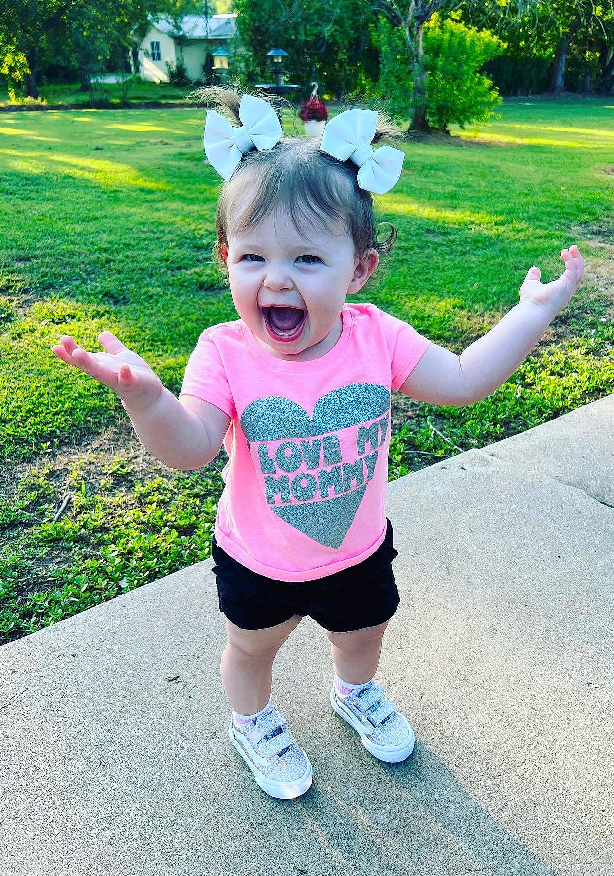 Raelynn is registered to the contest to win money with this photo: baby, baby_toddler_clothing, child, finger, fun, grass, green, happy, leaf, leisure, magenta, mammal, people_in_nature, person, pink, plant, shorts, sleeve, smile, summer