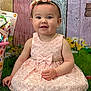 Ava joined the competition — help win amazing prizes! baby, background, child, cute, dress, flower_headband, flowers, grass, happy, headband, indoor, infant, person, pink_dress, playful, portrait, sitting, smile, toy_bucket, wooden_planks