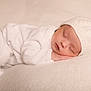 Eloann participe au concours pour gagner de l'argent avec cette photo : baby, sleeping, white_clothing, knit_hat, pom_pom, soft_blanket, peaceful, infant, cute, newborn, resting, cozy, closeup, portrait, child, warm, soft_texture, indoors, calm, serene