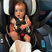 Oakley is registered to the contest to win money with this photo: baby, car_seat, infant, child, seatbelt, pacifier, blanket, graco, car_interior, safety, cute, young_child, sitting, clothing, comfort, transportation, strap, head_support, expression, indoors