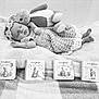 Riley-Hope is registered to the contest to win money with this photo: baby, sleeping, crocheted_dress, headband, stuffed_animal, bunny, blanket, books, peter_rabbit, children_books, soft_toy, infant, cozy, resting, cute, indoor, black_and_white, peaceful, portrait, child