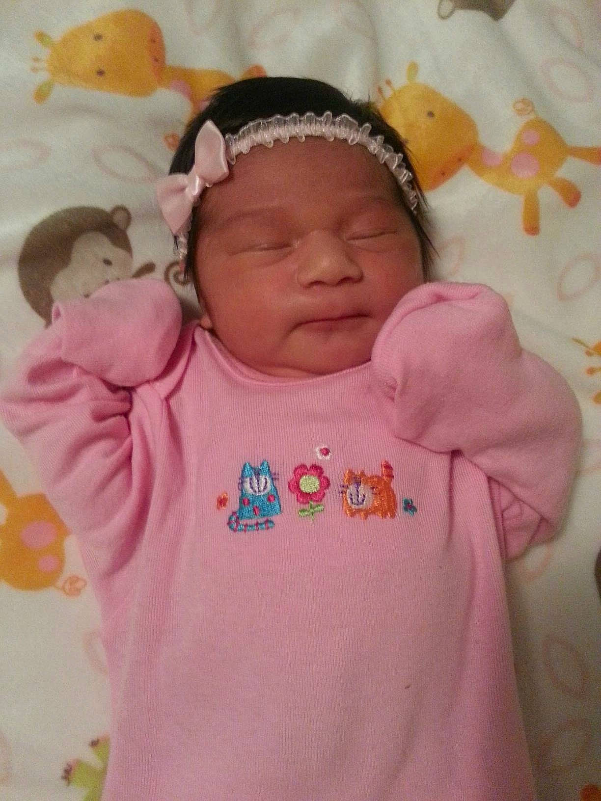 Khloe is registered to the contest to win money with this photo: baby, baby_products, baby_sleeping, baby_toddler_clothing, beanie, bonnet, cheek, child, hair_accessory, headband, headpiece, headwear, hood, nightwear, peach, person, pink, sleeve, toddler