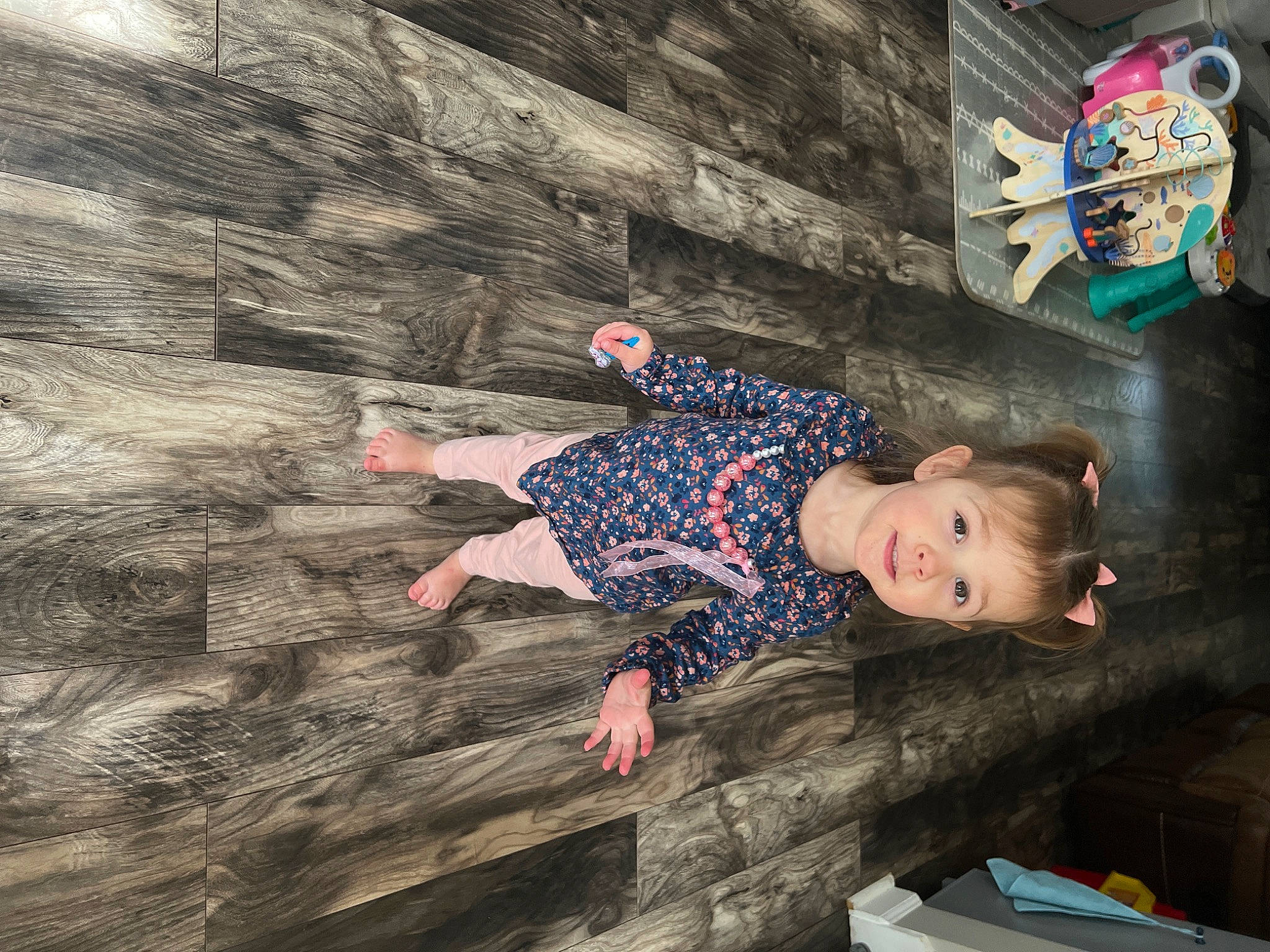 Rylee is registered to the contest to win money with this photo: adventure, child, denim, electric_blue, flash_photography, flooring, fun, happy, leisure, pattern, person, recreation, rock, sitting, soil, t_shirt, textile, toddler, visual_arts, wood