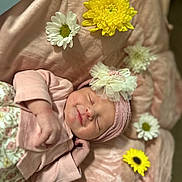 Paisleigh joined the competition — help win amazing prizes! baby, blanket, closeup, cute, face, flower, hand, headband, indoors, infant, newborn, peaceful, pink_clothing, portrait, resting, skin, sleeping, soft_texture, white_flower, yellow_flower