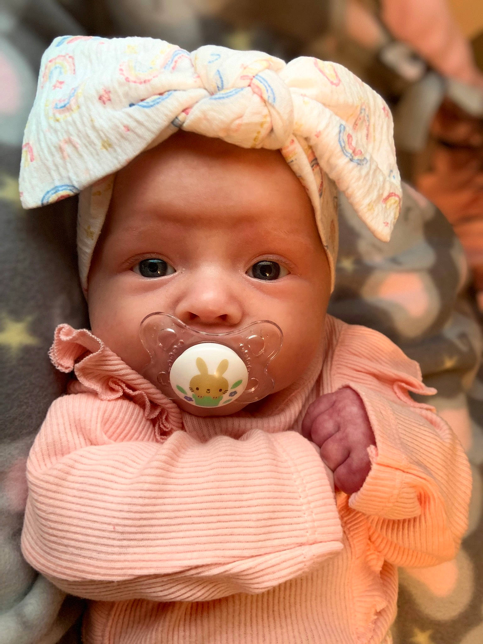 Journey is registered to the contest to win money with this photo: baby, cheek, eye, face, facial_expression, food, fruit, happy, head, human, human_body, iris, lip, mouth, nose, organ, person, pink, plant, skin