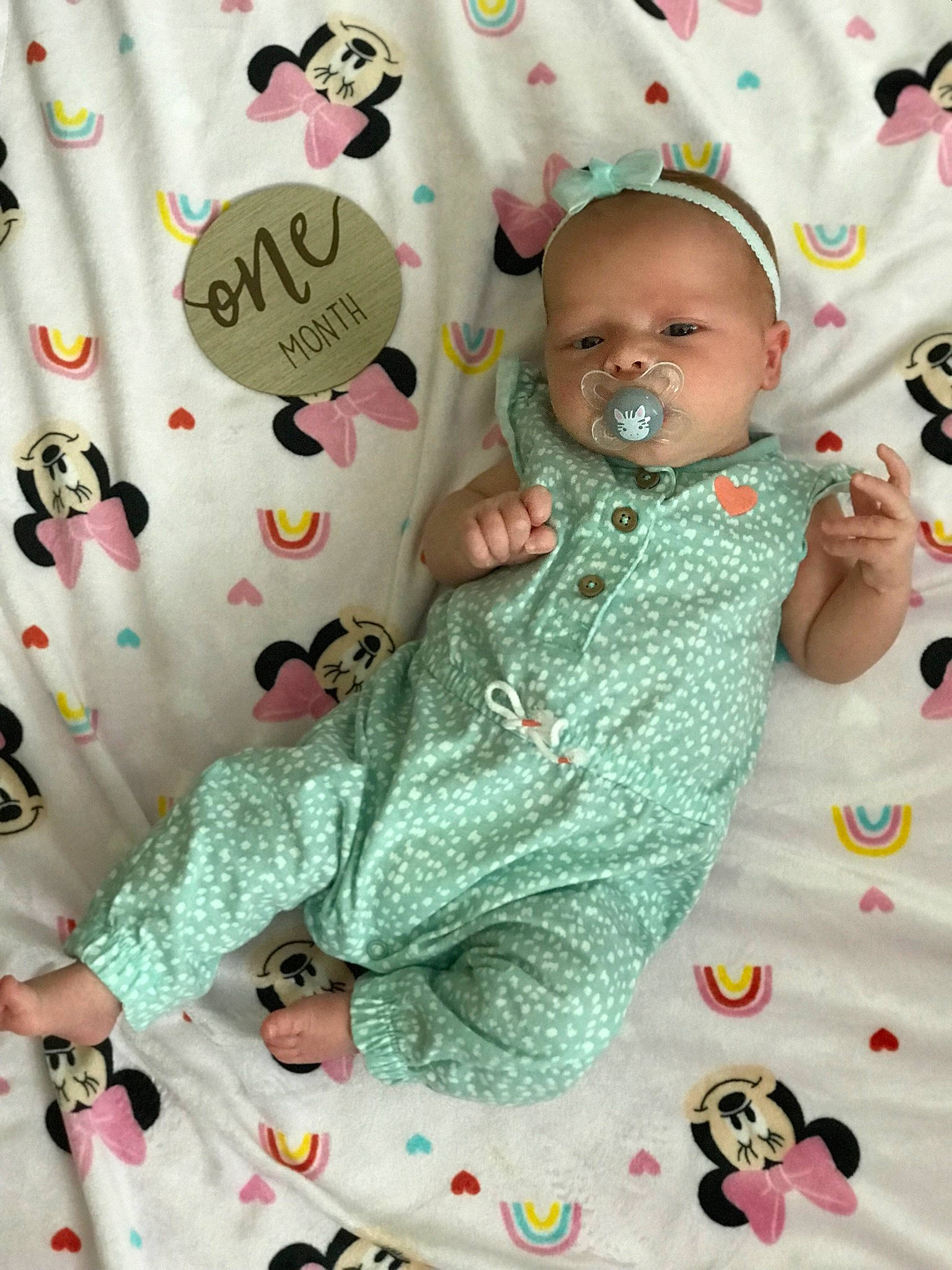Journey is registered to the contest to win money with this photo: baby, baby_products, baby_toddler_clothing, baby_toys, beauty, cheek, child, comfort, facial_expression, green, happy, head, linens, pattern, person, pink, room, sleeve, textile, toddler