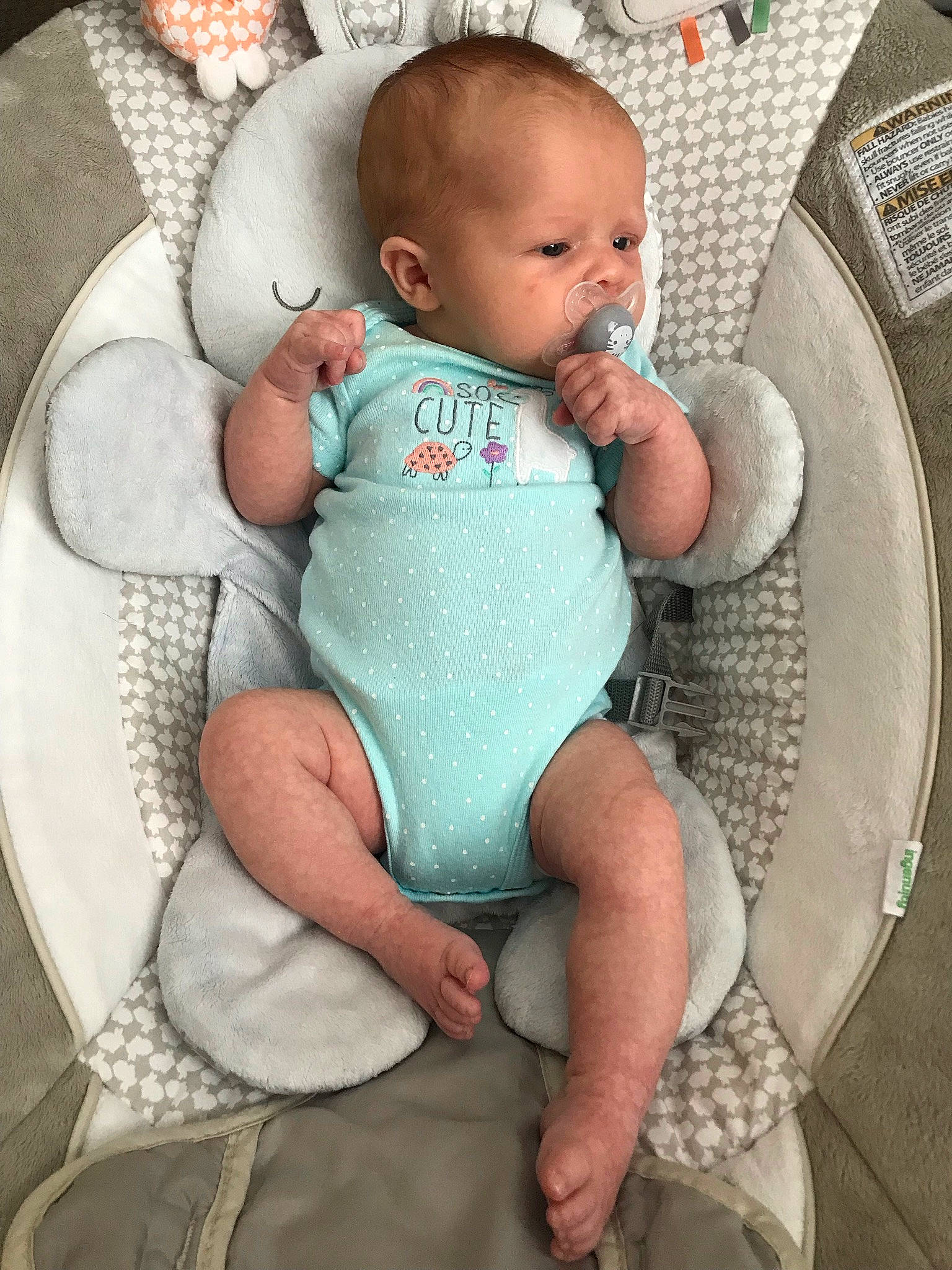 Journey is registered to the contest to win money with this photo: baby, baby_products, baby_safety, baby_sleeping, baby_toddler_clothing, chair, chest, child, comfort, face, infant_bodysuit, lap, leg, linens, person, pillow, product, sitting, skin, thigh