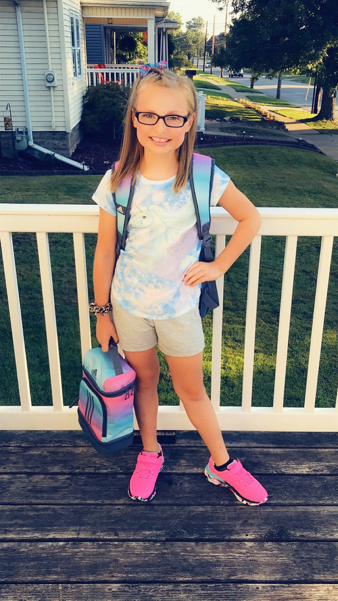 Alannah is registered to the contest to win money with this photo: cool, eyewear, face, fashion, fence, footwear, happy, joy, knee, leisure, person, pink, plant, shoe, shorts, sleeve, street_fashion, style, t_shirt, textile