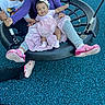 baby, children, siblings, family, playground, swing, smiling, happy, portrait, outdoor, seated, infant, toddler, glasses, pink_dress, purple_shirt, colorful_shoes, playground_equipment, blue_floor, group_photo