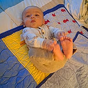 Angelemmanuel is registered to the contest to win money with this photo: baby, bedroom, blanket, child, comfort, cozy, cute, expression, face, foot, hand, head, indoor, infant, lying_down, pajamas, person, quilt, sleepwear, soft