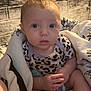 Adalynn is registered to the contest to win money with this photo: baby, infant, blanket, pacifier, socks, patterned_clothing, indoor, wall, stone_wall, curious, child, person, young, cute, portrait, seated, soft_lighting, closeup, hands, face