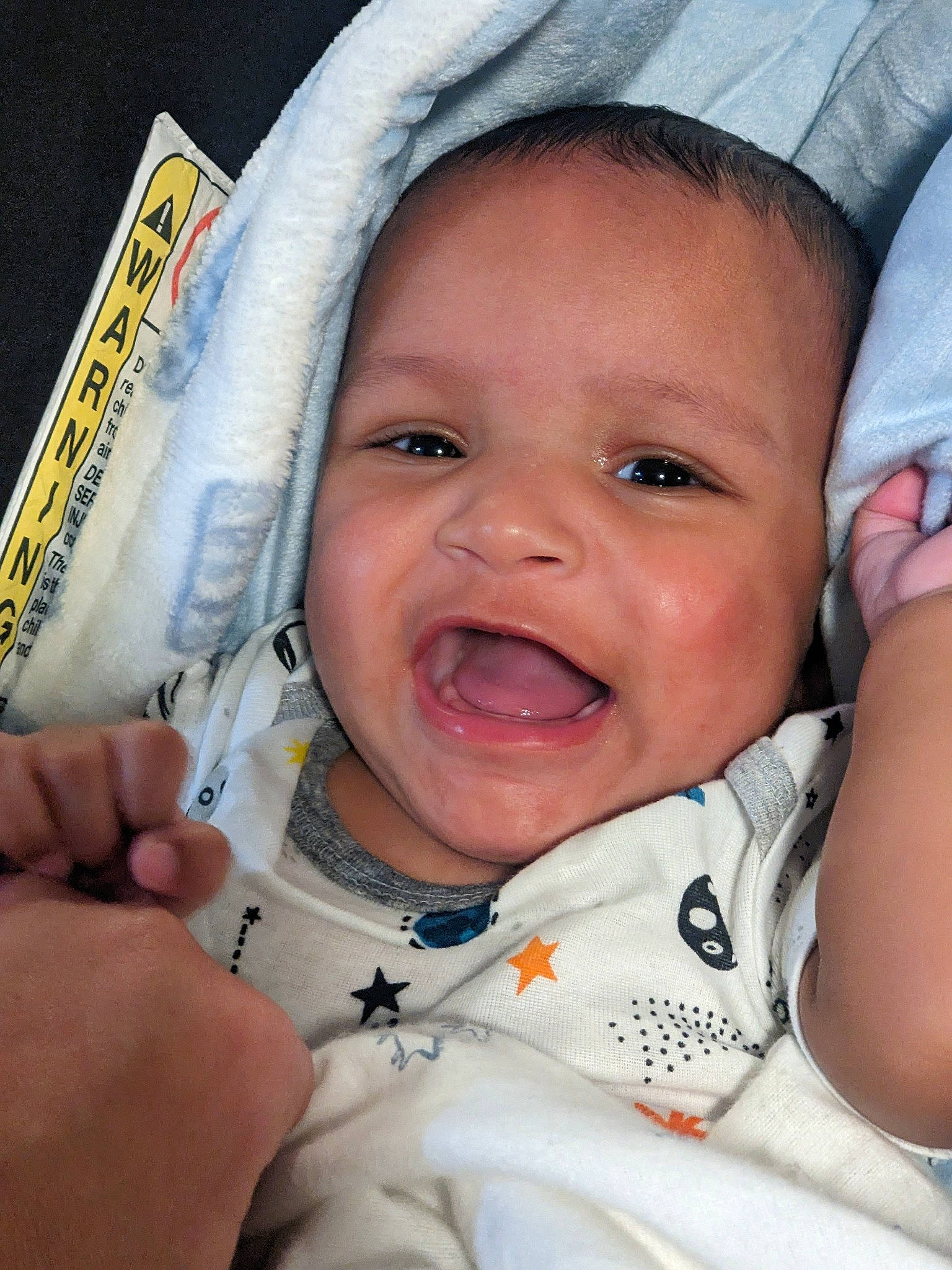 Devon is registered to the contest to win money with this photo: baby, cheek, chin, eye, eyebrow, finger, fun, gesture, hand, happy, head, iris, lip, mouth, nose, person, skin, smile, thumb, toddler