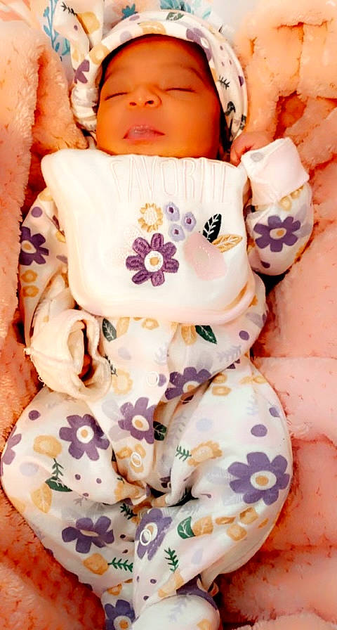 Mines Serenity Blessiyn Hughes joined the competition — help win amazing prizes! abdomen, baby, baby_sleeping, baby_toddler_clothing, cheek, collar, comfort, eye, linens, orange, pattern, peach, person, pink, plush, sleeve, stuffed_toy, textile, toddler, white