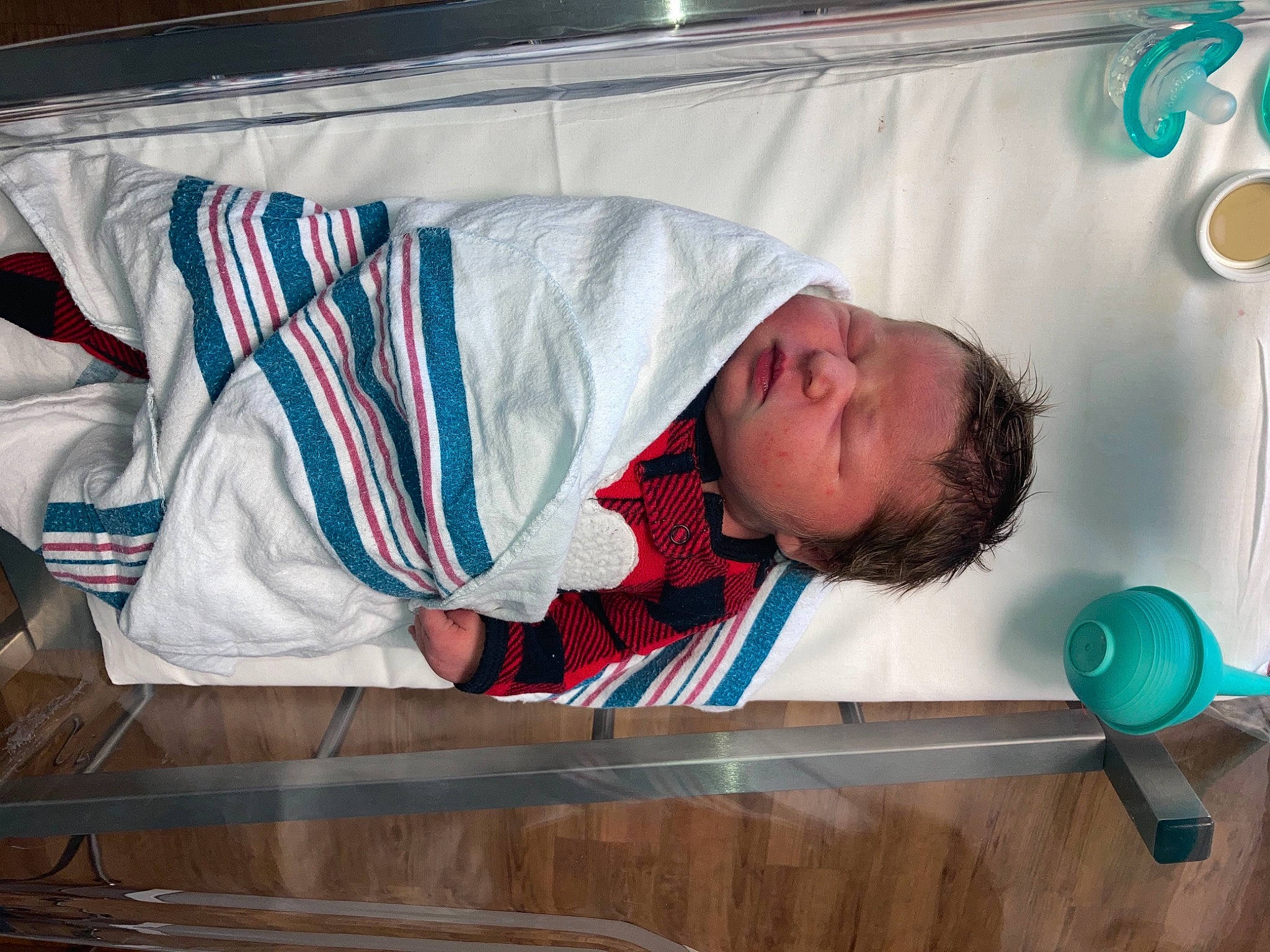 Korra is registered to the contest to win money with this photo: baby, comfort, elbow, electric_blue, linens, microphone, person, room, wood