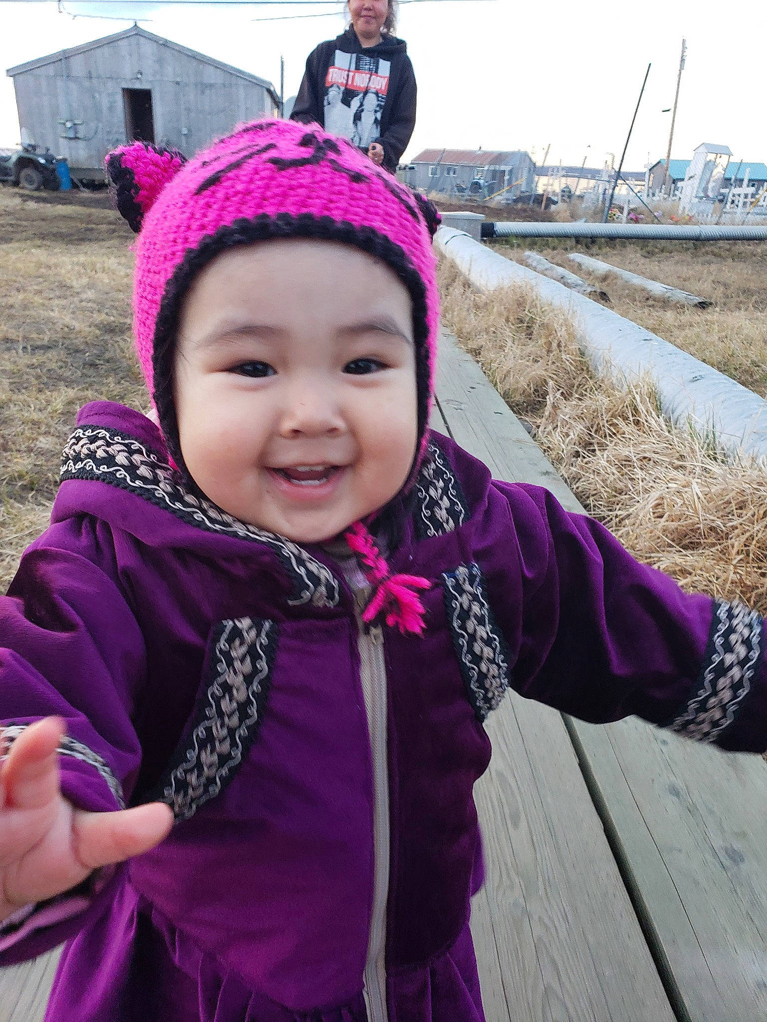 Helena is registered to the contest to win money with this photo: cap, child, clothing, face, freezing, grass, happy, headwear, jacket, joy, leisure, magenta, person, pink, purple, recreation, skin, sky, sleeve, smile